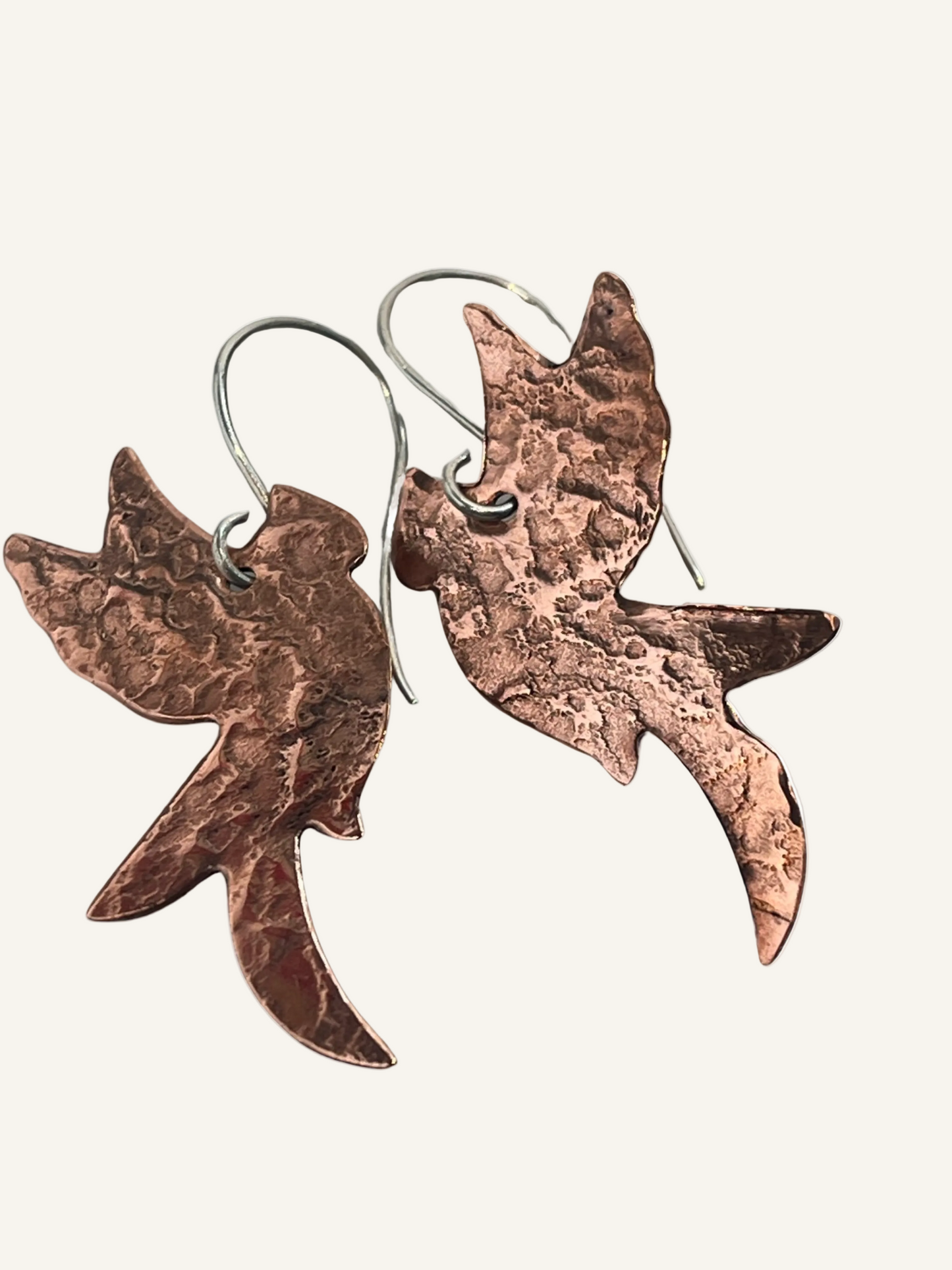Handcrafted copper phoenix earrings with sterling silver ear wires. Exclusive to Phoenix Silver, symbolizing rebirth and transformation.