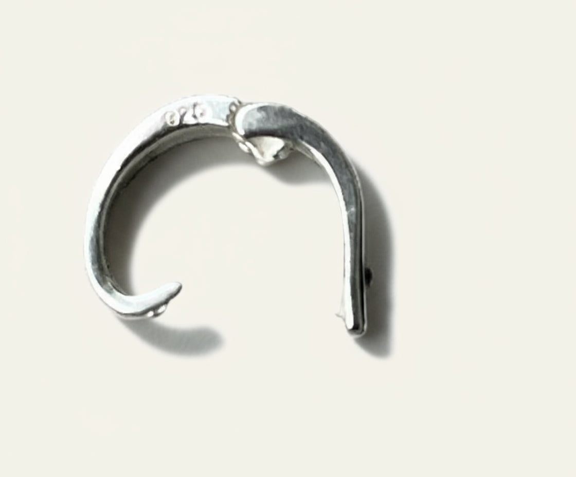 Silver pearl enhancer on a white background