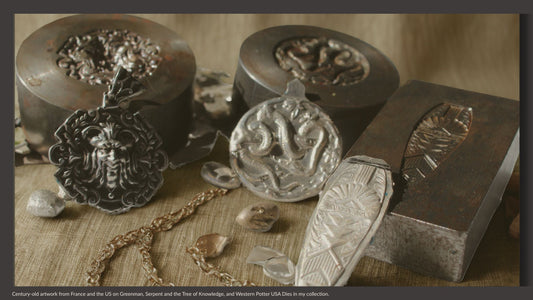 Antique jewelry dies from France and the United States with pressed silver pendants on linen, photographed in warm natural light to illustrate the artistry preserved by Phoenix Silver.